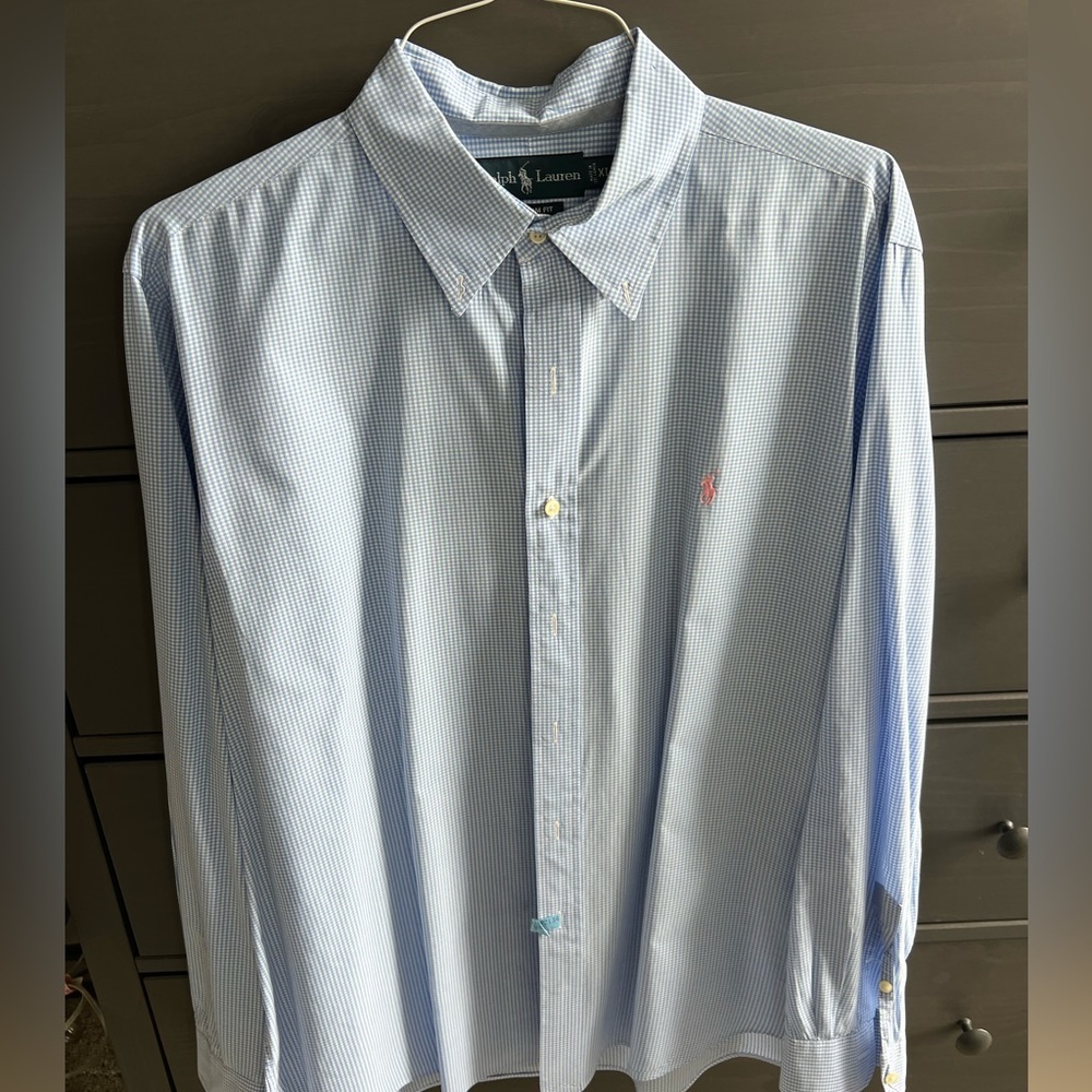 Blue checkered polo dress shirt with pink logo